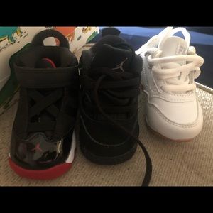 2 pair of jordans and 1 pair of filas